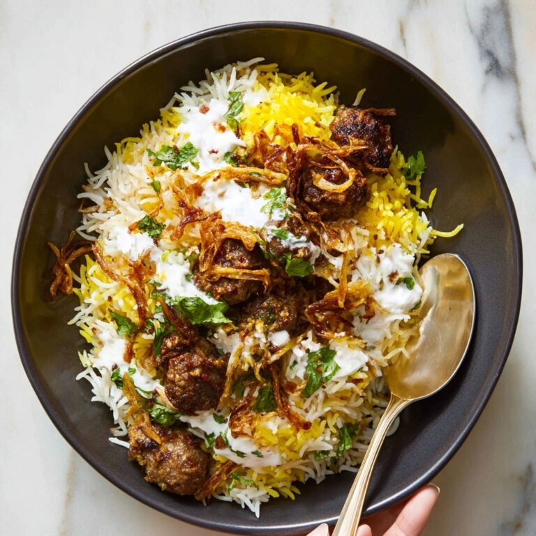 Creamy Spiced Chicken Biryani with Saffron and Crispy Onions Recipe